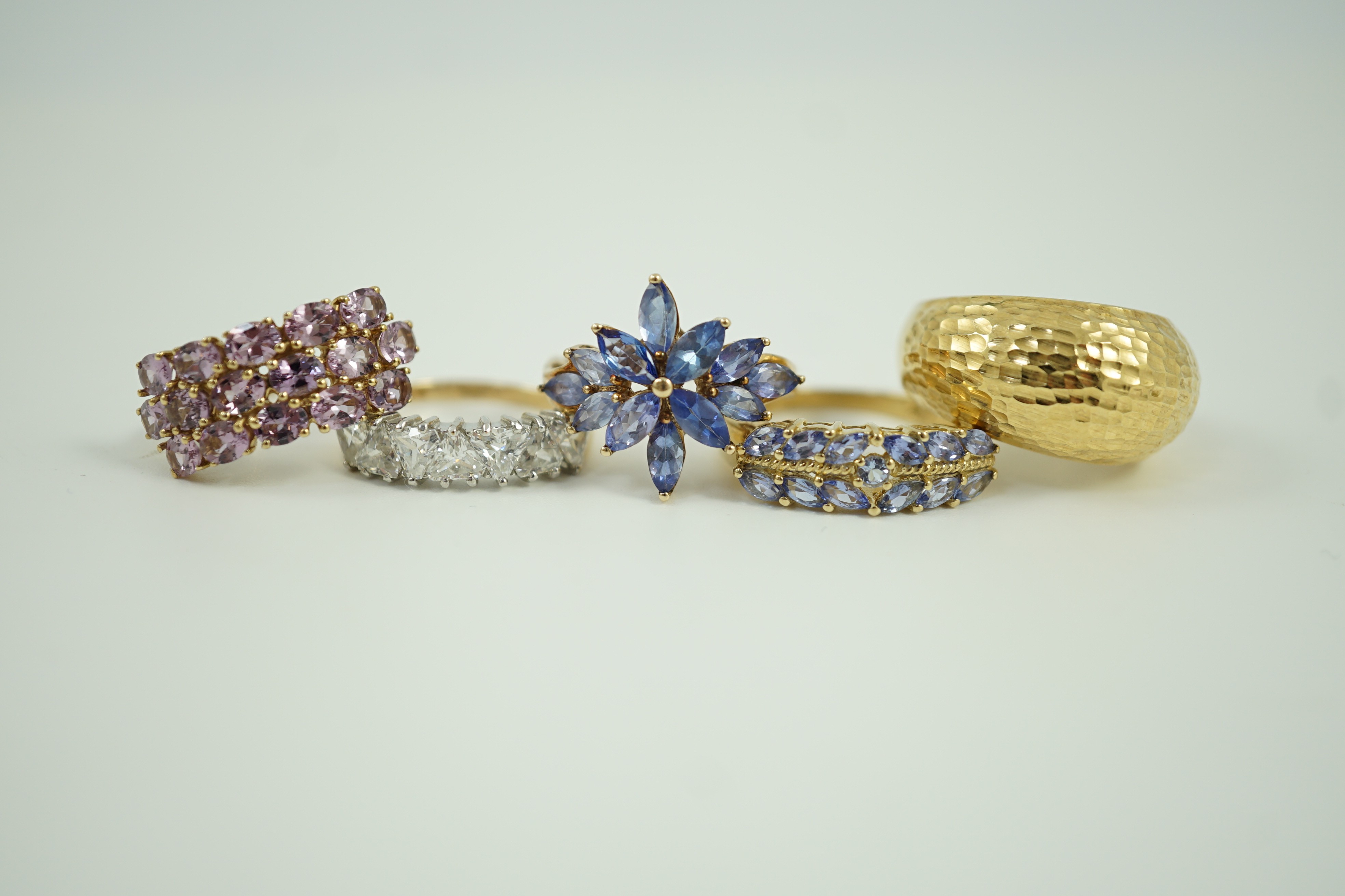 Four assorted modern 9ct gold and gem set rings and an Italian 375 ring, gross weight 14.4 grams.